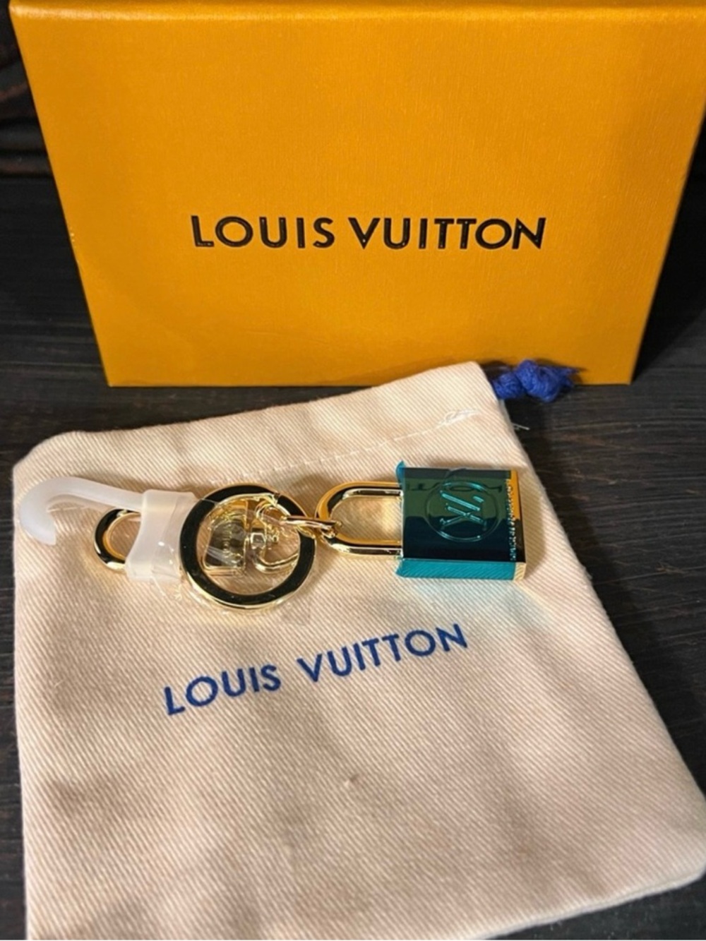 Louis Vuitton Gold Padlock Bag Charm includes dust bag and box authentic